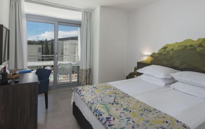 Slaapkamer van Hotel Bluesun Alga in Dalmatië