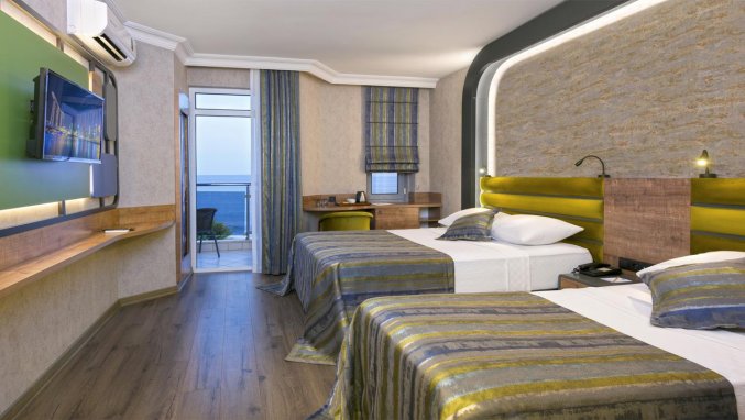 Slaapkamer van Hotel Monart City in Alanya